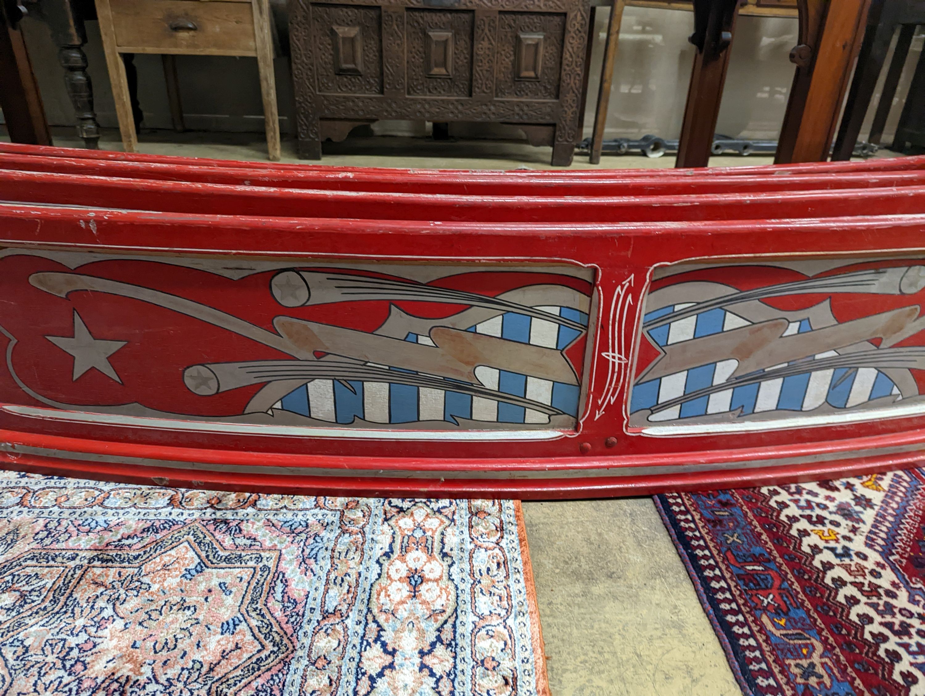 Four vintage painted fairground boards. Length-183cm, Height-39cm.